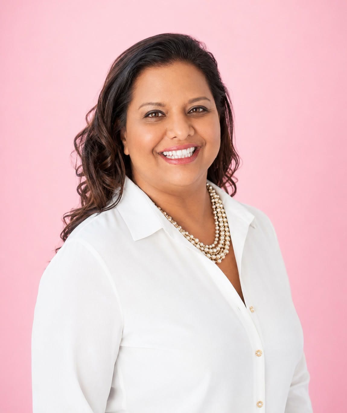 Karen Baring, founder of BusiWomen, in a white shirt and pearls